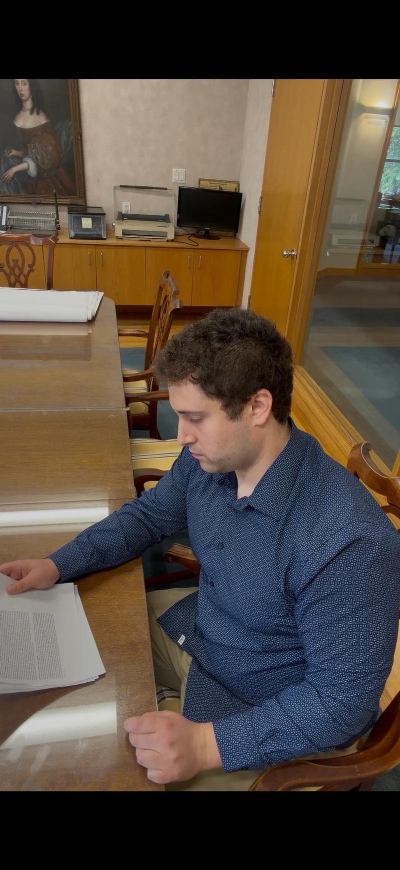 Gabriel Rogoff, Mapley’s founder, signing the lease for the ice cream shop.